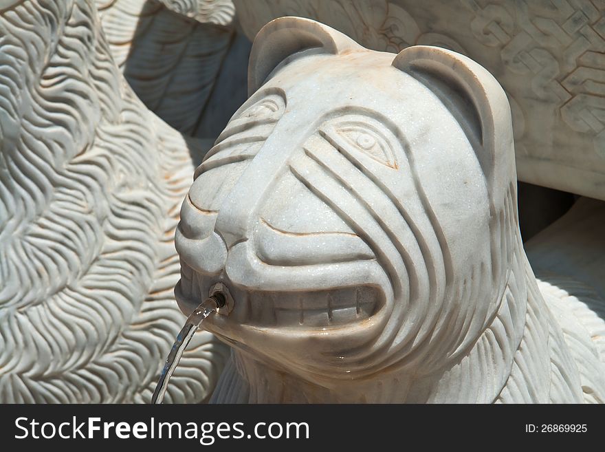 Details of an animal head statue water fountain. Details of an animal head statue water fountain