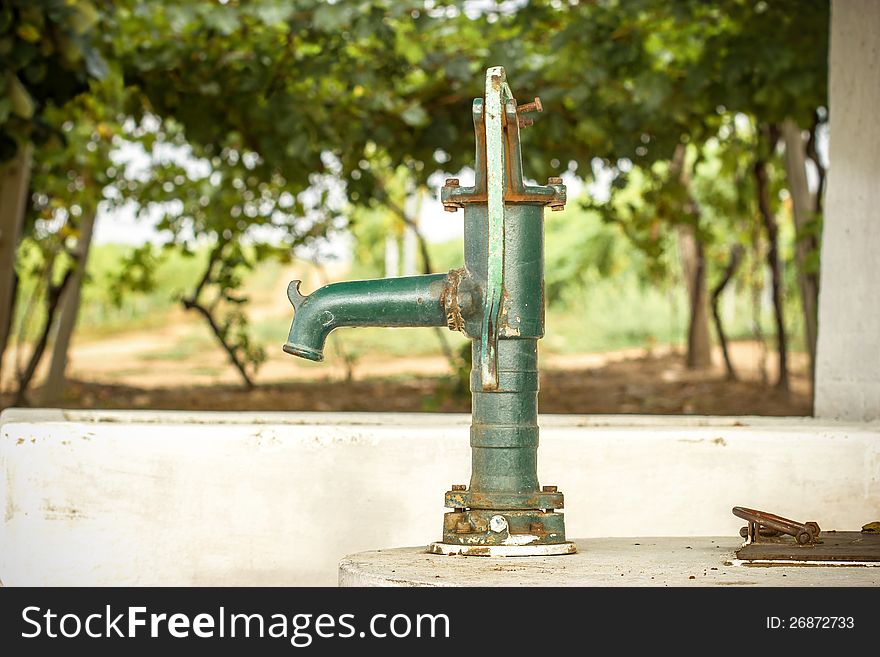 Old Hand water pump in the vineyard