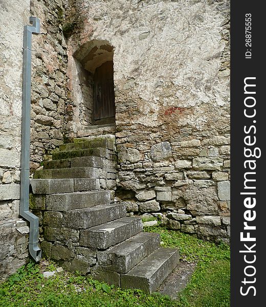 Staircase of a XIII age church in Valjala, Estonia, with modern rain pipe. Staircase of a XIII age church in Valjala, Estonia, with modern rain pipe