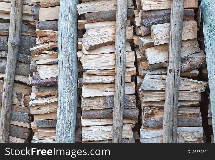 A pile of firewood for poles backed. A pile of firewood for poles backed.