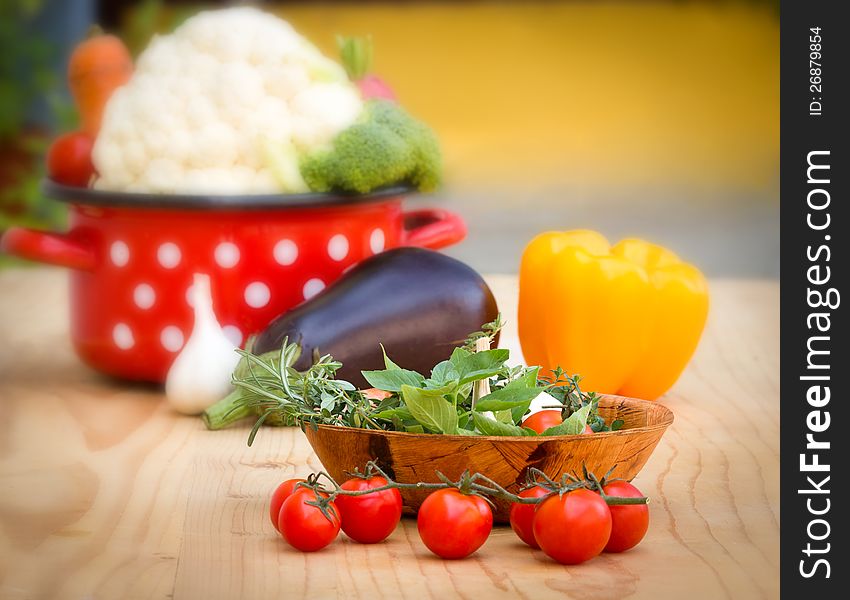 Fresh organic vegetables, herbs and spices on the table