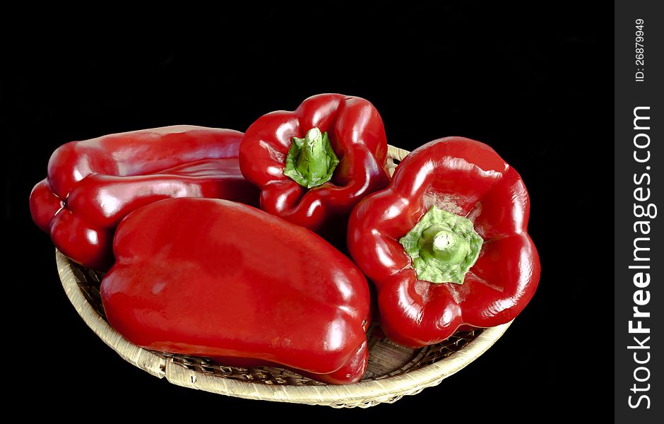 Ripe red  pepper isolated over black background