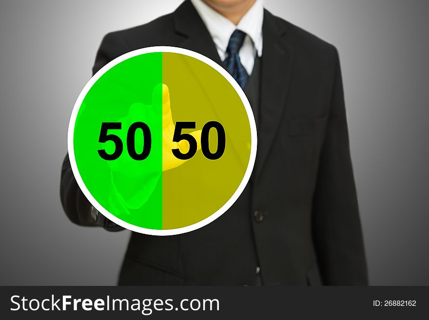 Business man touching on Pie chart with fifty-fifty percent. 50 50 chance