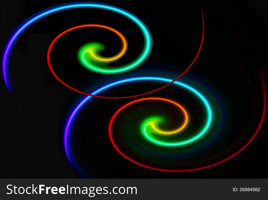 Twin twirls made of colorful laser from a disc.