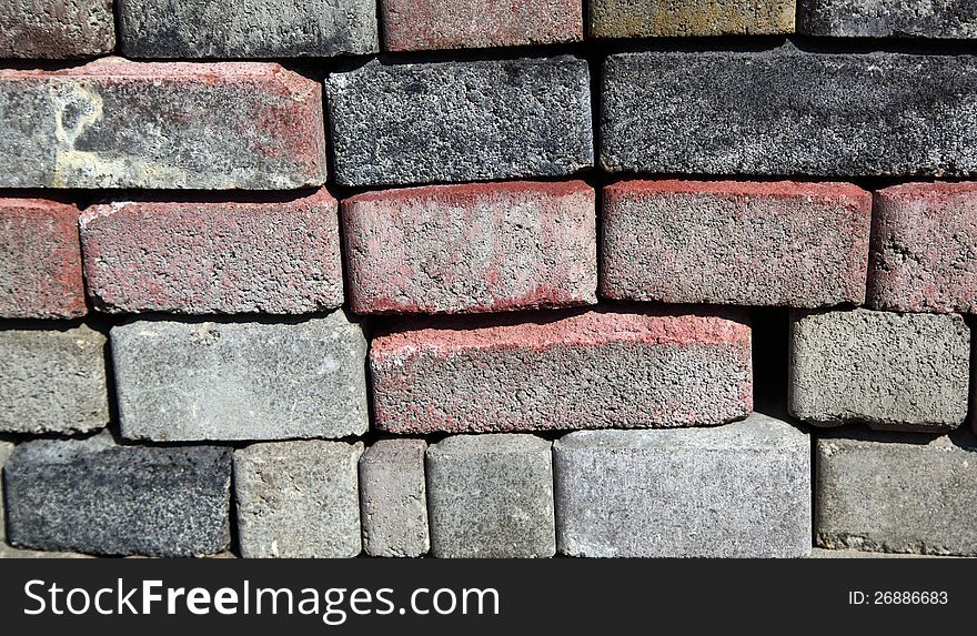 Background: a wall of gray bricks