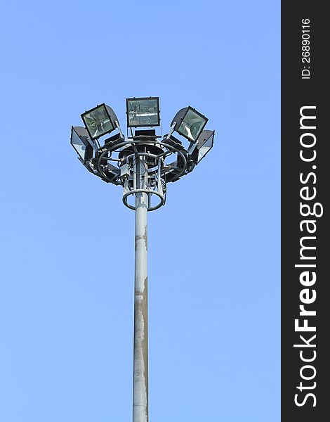 Spotlight tower for traffic on blue sky background