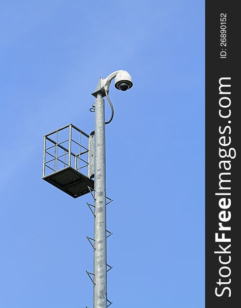 Security camera for car parking on blue sky background