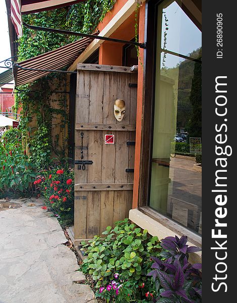 Opened door from tropical wood to early morning in green garden - conceptual. Opened door from tropical wood to early morning in green garden - conceptual