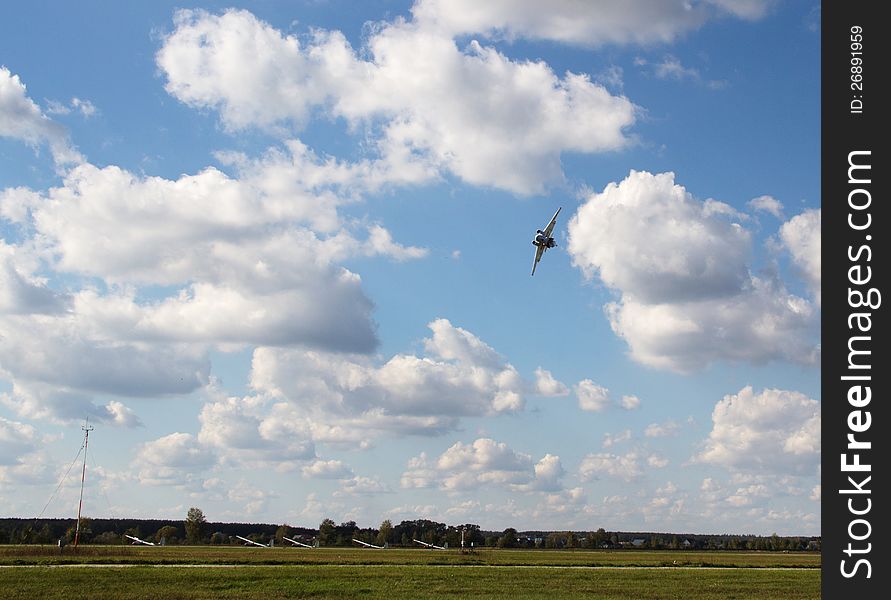 Aircraft airfield flying over  in blue sky background