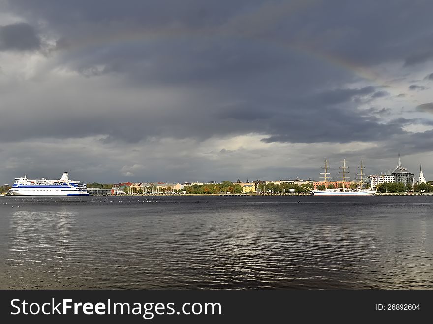 View on river embankment and one of the biggest yacht in the world, Riga, Latvia, Europe. View on river embankment and one of the biggest yacht in the world, Riga, Latvia, Europe