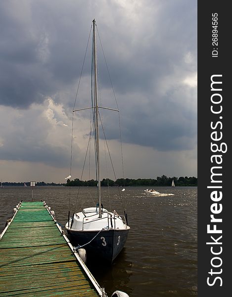 Yacht on platform on lake. Yacht on platform on lake