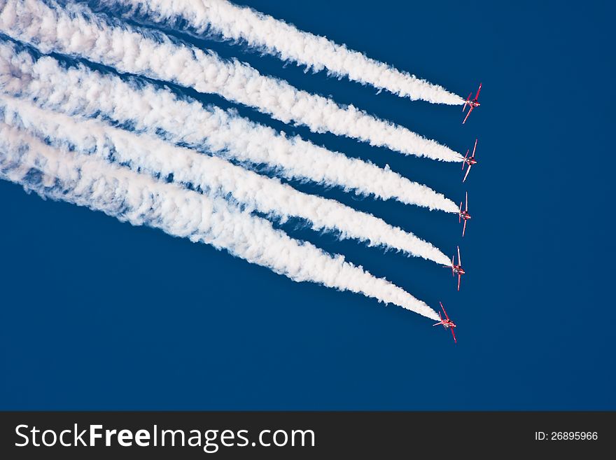 Air show performance with jet fighters - Red Arrows Royal Air Force Aerobatic Team. Air show performance with jet fighters - Red Arrows Royal Air Force Aerobatic Team