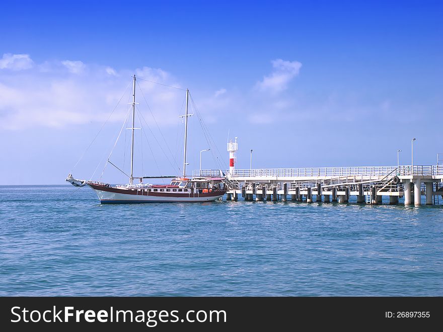 Frigate moored to a pier