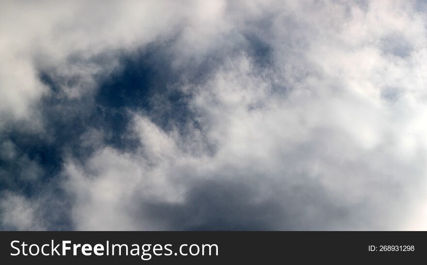 Blue background, sky with white clouds