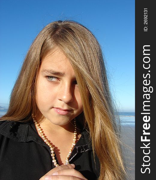 Young girl on the beach, Head & Shoulders shot with jewellery. Young girl on the beach, Head & Shoulders shot with jewellery