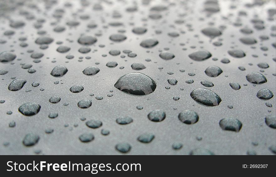 Rain drops on a body car