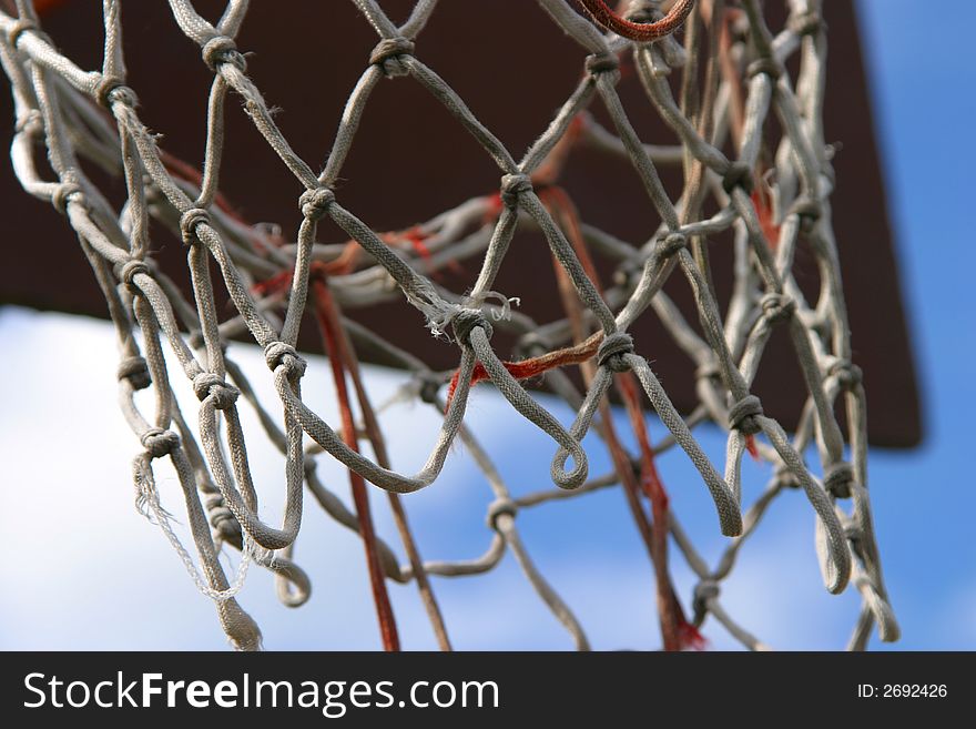 A basketball board with an old net.