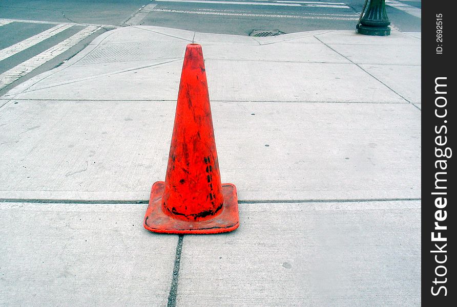 Orange traffic cone on Spokane sidewalk. Orange traffic cone on Spokane sidewalk.