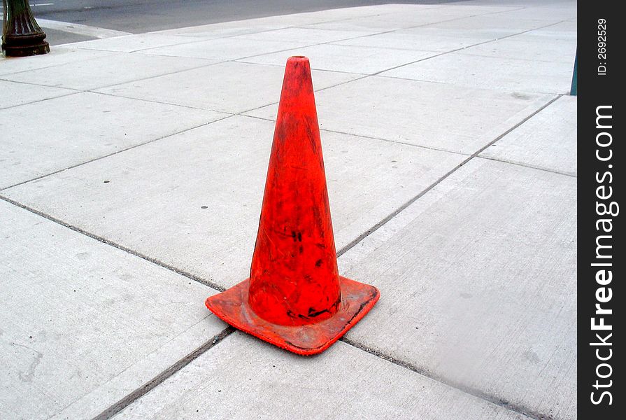 Orange traffic cone on Spokane sidewalk. Orange traffic cone on Spokane sidewalk.