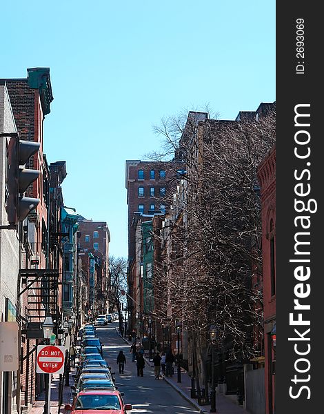 Looking up one of the many brownstone lined streets in boston's beacon hill district,. Looking up one of the many brownstone lined streets in boston's beacon hill district,