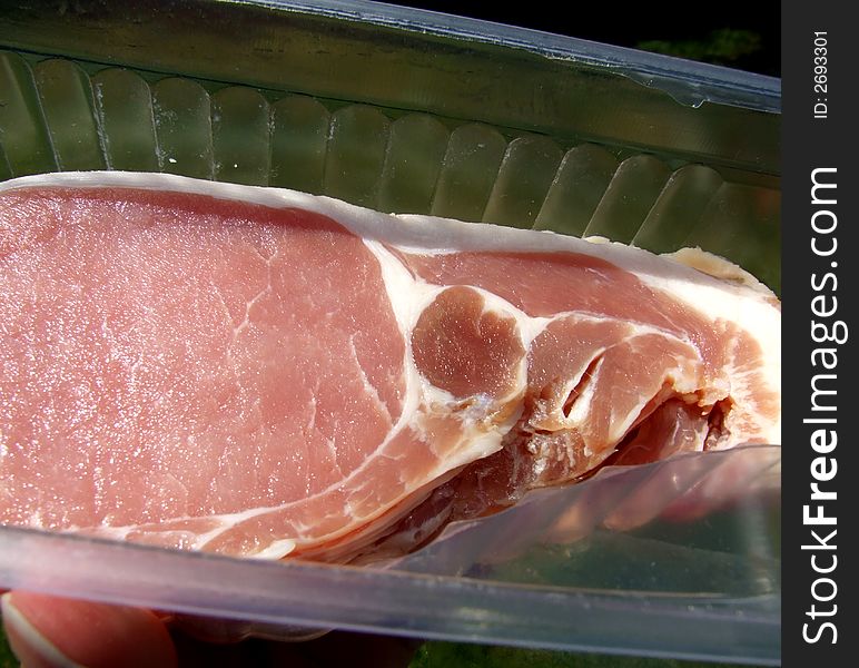 An image of some sliced bacon within its package. An image of some sliced bacon within its package.