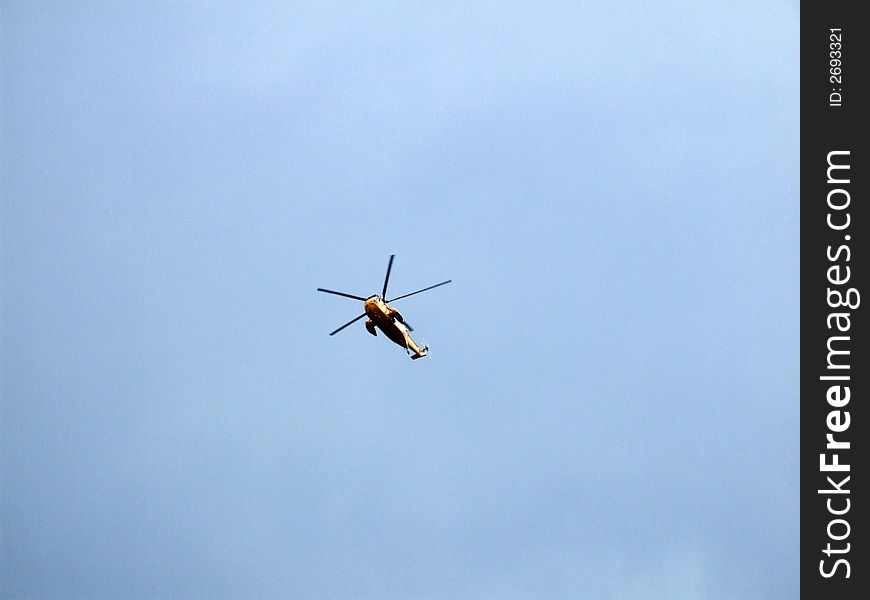 An image of a helicopter flying in the sky.