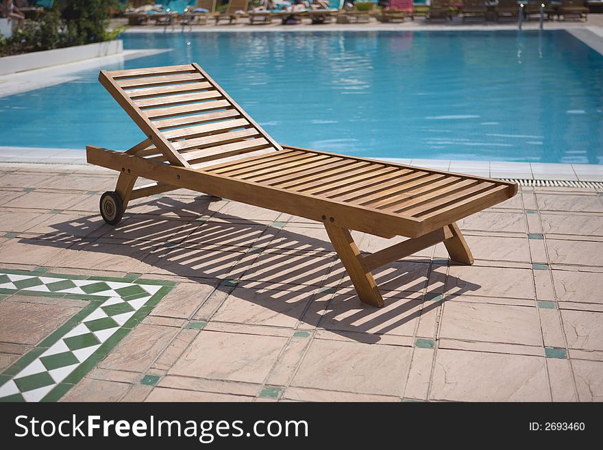 Sun lounger close to the pool. Sun lounger close to the pool