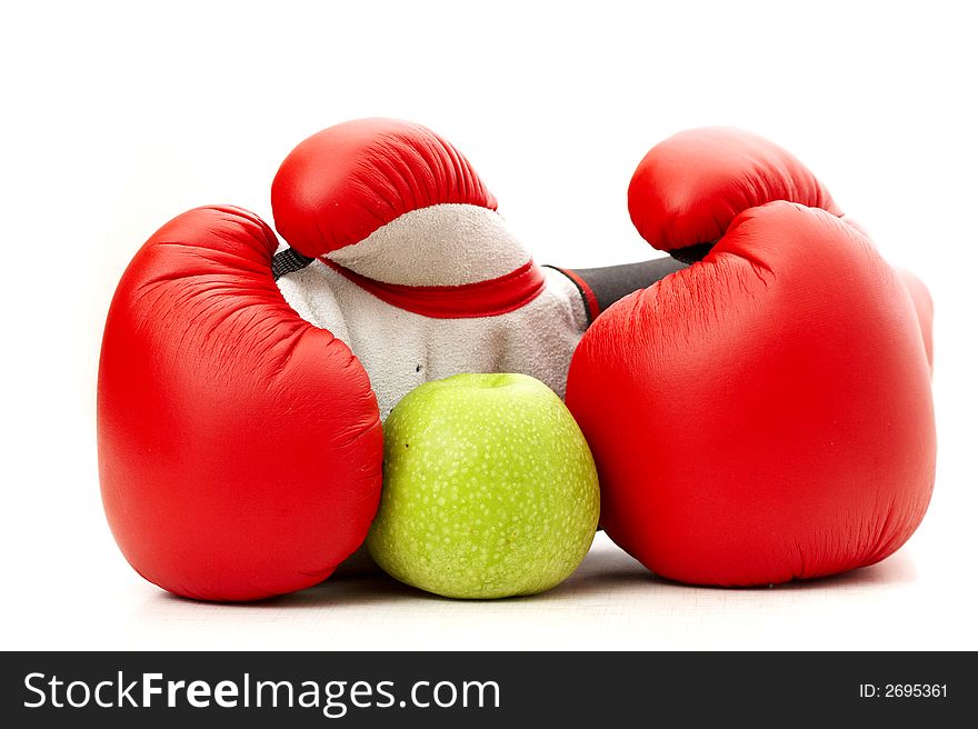 Boxing gloves and an apple. Boxing gloves and an apple