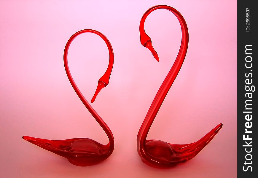 This is two swans stuettes from red glass. This is two swans stuettes from red glass.