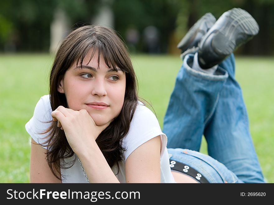 Girl lying on meadow. Portrait