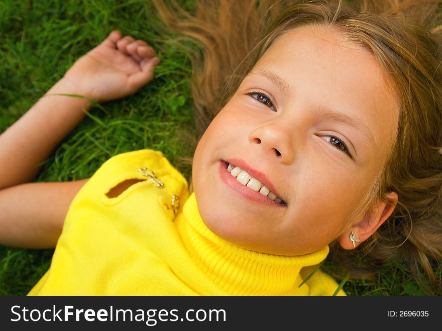 Little girl lying on a grass. Little girl lying on a grass