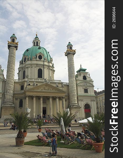 Sunbathers et the St. Charles Cathedral (Karlskirche) in Vienna.