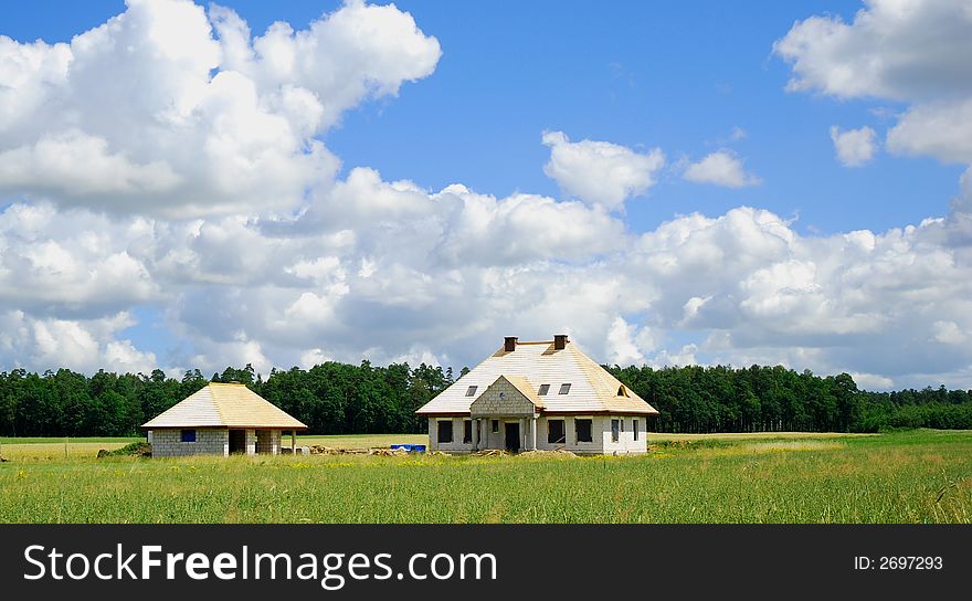 We build a new house on countryside. Home under construction. We build a new house on countryside. Home under construction.