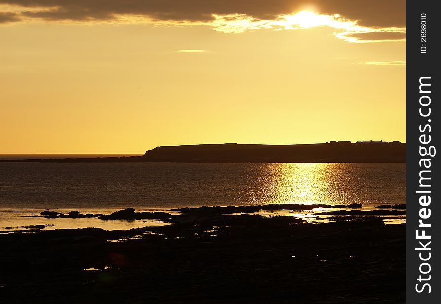 Sunset near Stromess with cliff. Sunset near Stromess with cliff