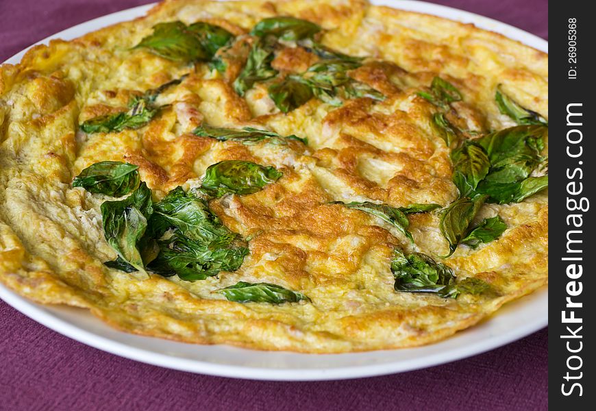Fried beaten eggs with sweet basil