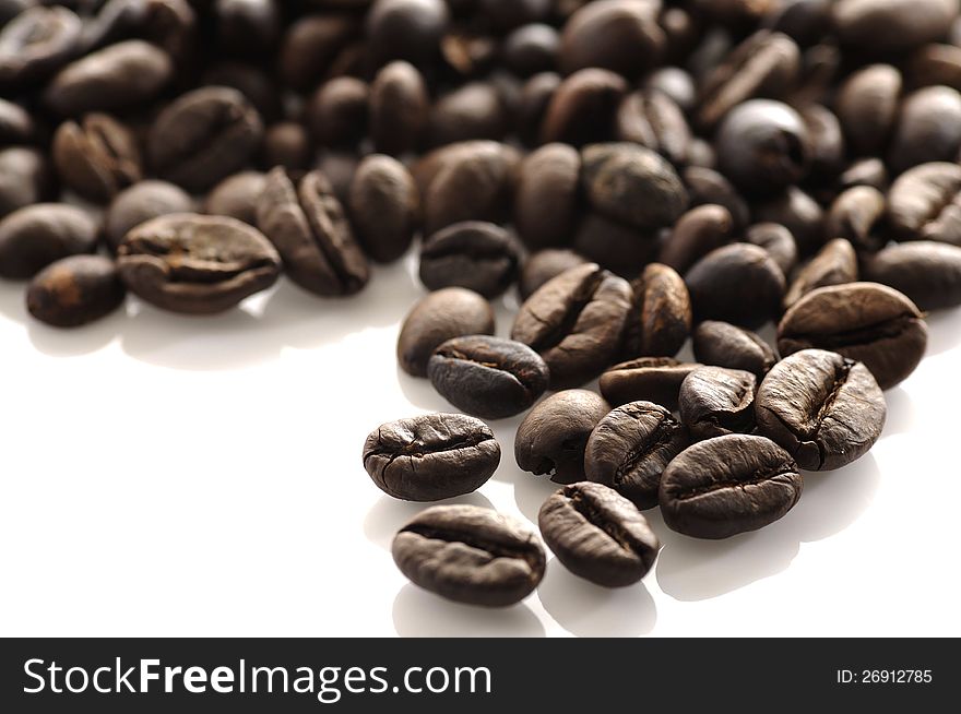 Roasted coffee bean shot on white background