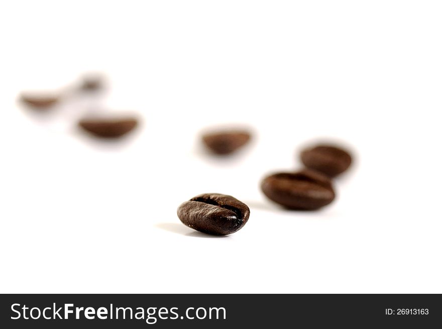 Roasted coffee bean shot on white background