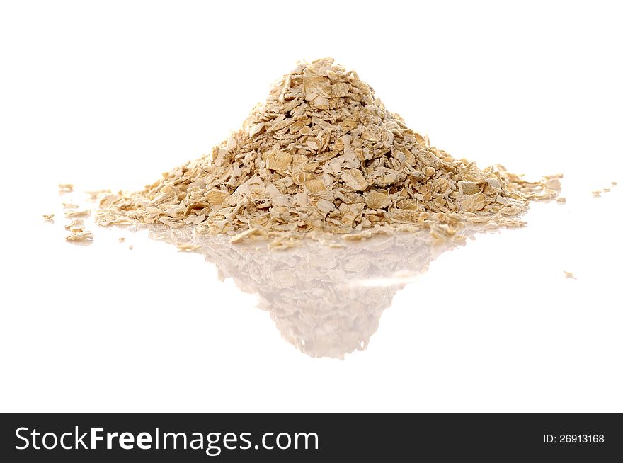 Pile of oatmeal over white background