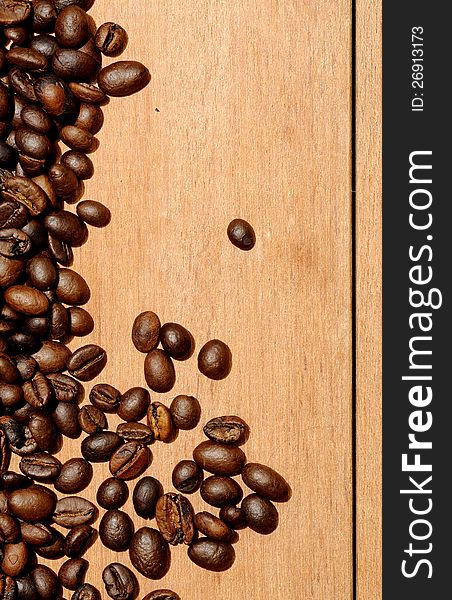 Coffee beans shot on the wooden background