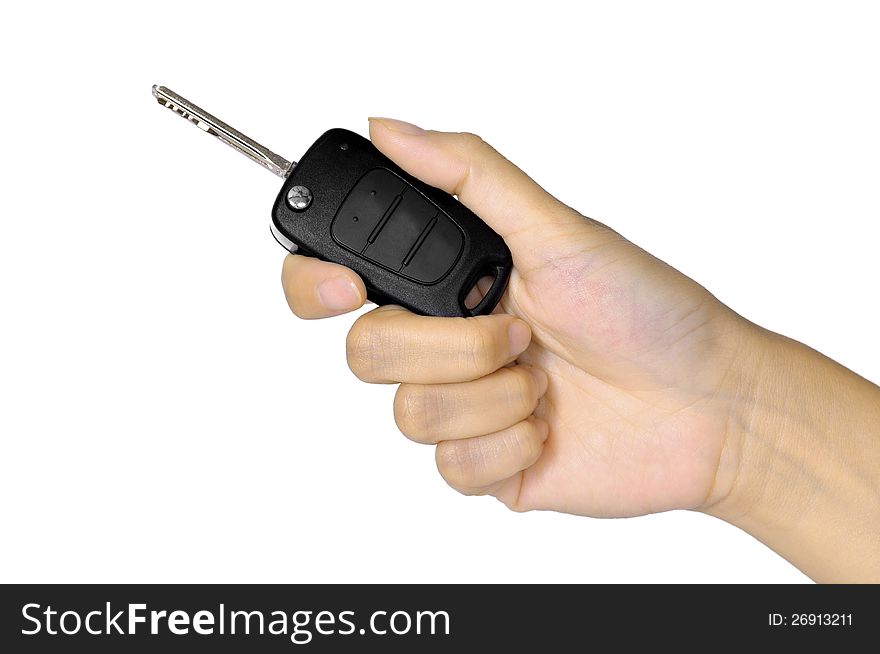 Hand with car key isolated over white background. Selling car concept