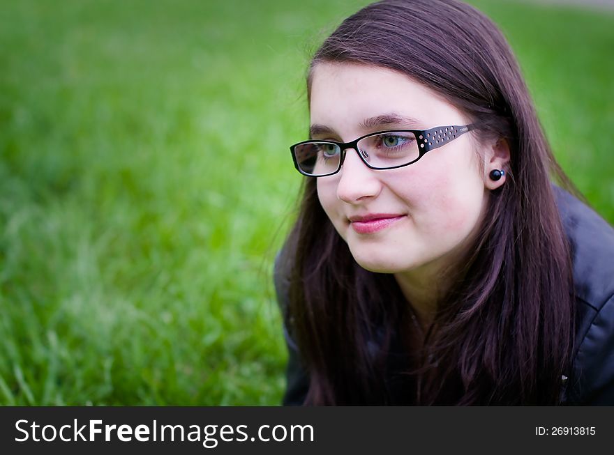Girl teen outdoors closeup in a meadow