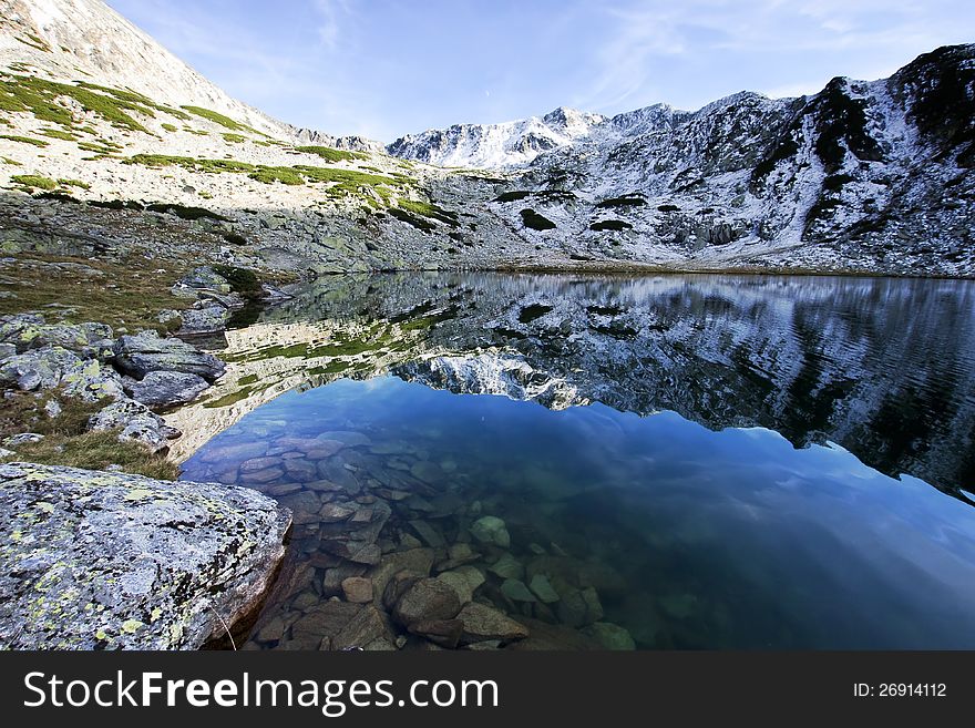 Alpine lake reflection - Retezat Mountains