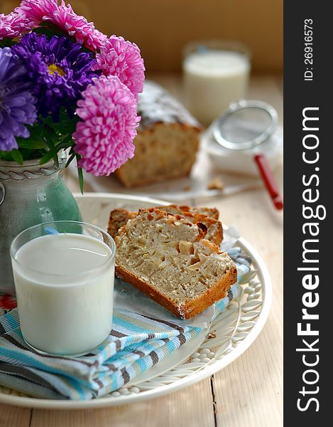 Two Slices of Apple Cake with a Glass of Milk