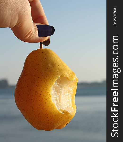 Hanging pear you can eat in a woman's hand
