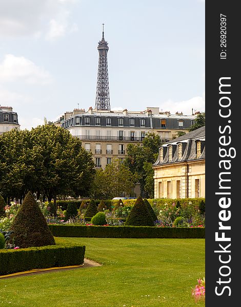 The Eiffel Tower sticking up behind Parisian Architecture; in vertical orientation with copy space for text