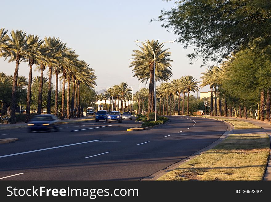 Curve of road on a southwest city street at sunset