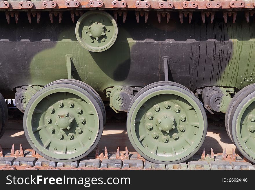 Up close view of tank tracks and associated drive wheels. Up close view of tank tracks and associated drive wheels.