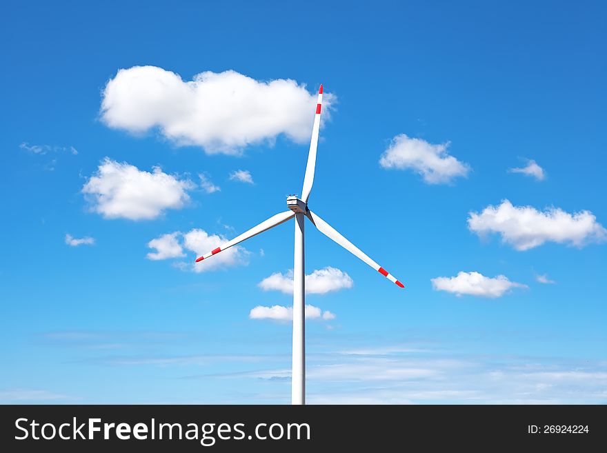 Windmill against the sky with clouds