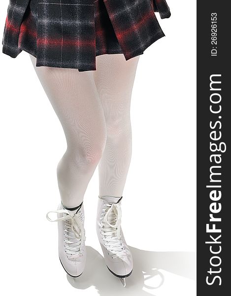 The legs of a figure skater wearing white tights, a checkered dress and ice skates on a white background. The legs of a figure skater wearing white tights, a checkered dress and ice skates on a white background