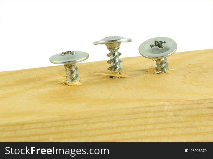 Vkruchennye Screws In A Wooden Board